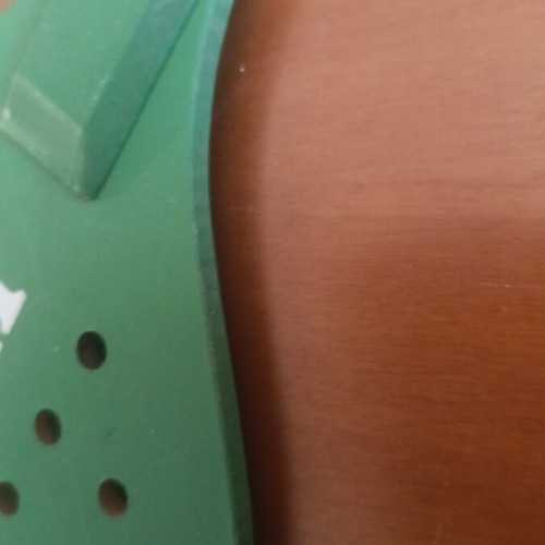 Heineken wooden promotional paddle with color defect