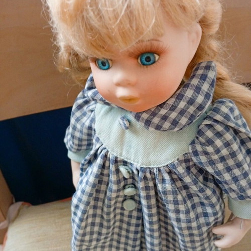 Porcelain doll used with stand, 33 cm tall