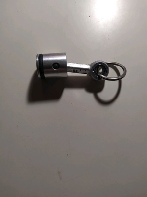 Piston keychain with aluminum connecting rod used