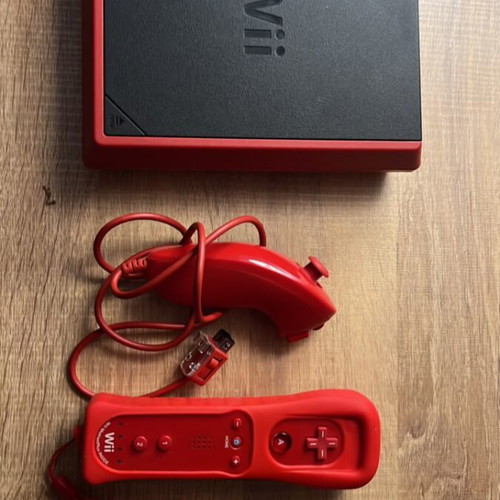 Nintendo Wii Mini console with 2 red controllers