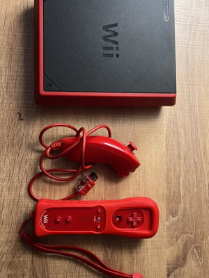Nintendo Wii Mini console with 2 red controllers