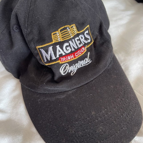 Magners cider branded hat used with small discoloration