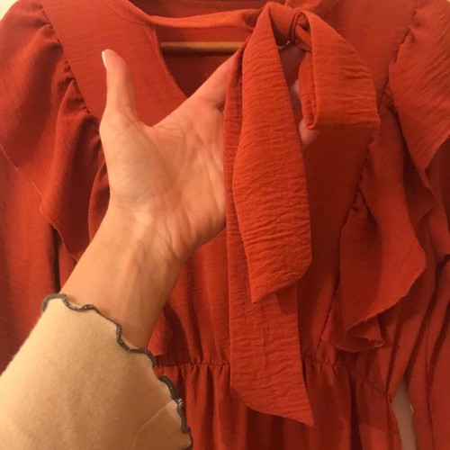 Coral dress like new with ruffles and front frill