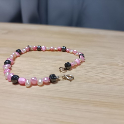 Bracelet with white, black and pink stones, heart charm