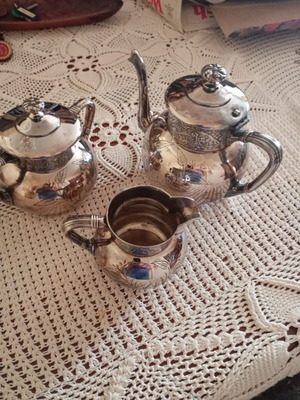 Antique silver plated teapot, sugar bowl and creamer like new
