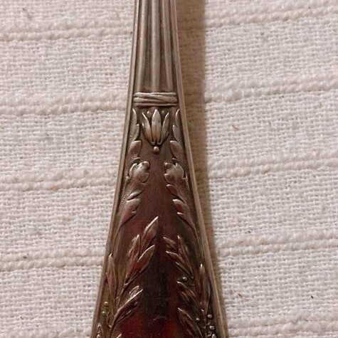Vintage silver-plated food fork used with embossed decoration