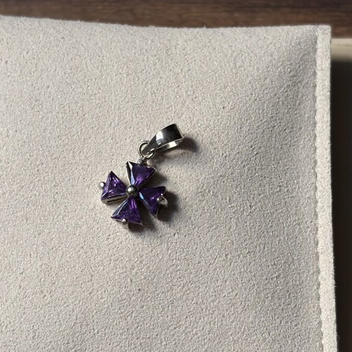 Small purple cross charm like new, no chain