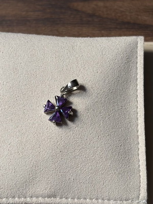 Small purple cross charm like new, no chain
