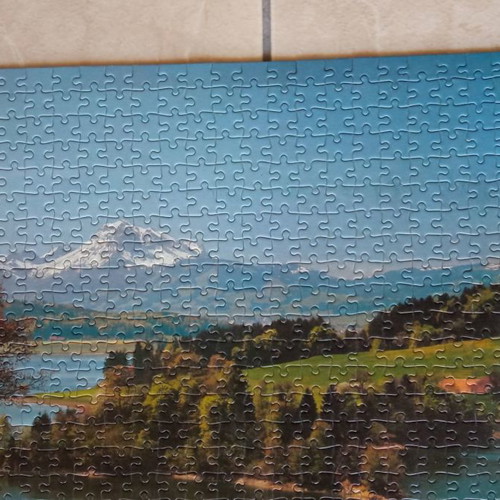 Puzzle board used with 1000 pieces glued on cardboard