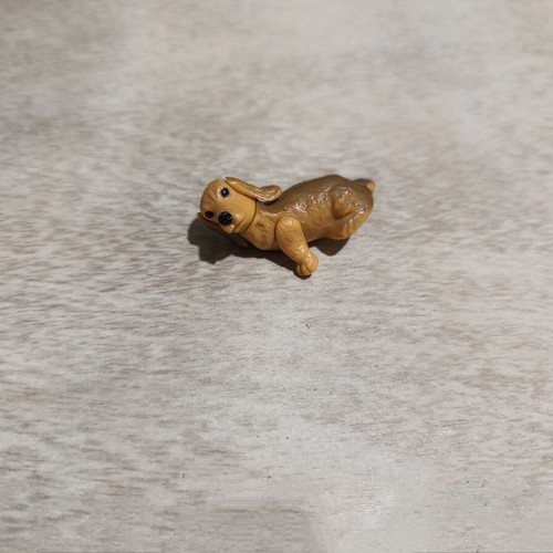 Dog figure used from old Zaini surprise eggs, missing one arm