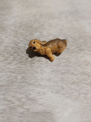 Dog figure used from old Zaini surprise eggs, missing one arm