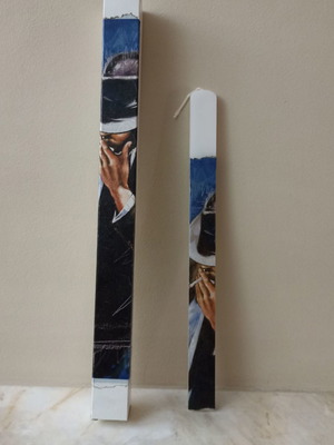 Candle with decoupage featuring a man smoking theme