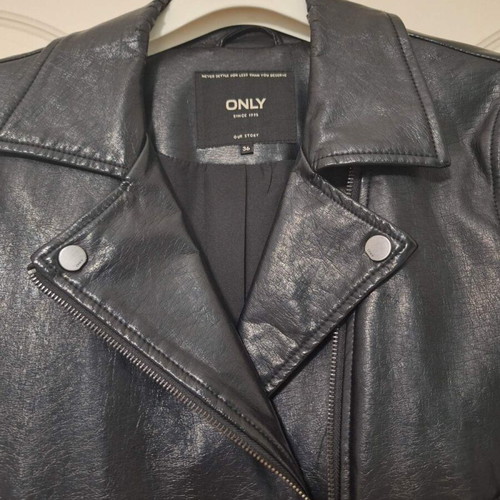 Only black biker jacket made of faux leather with silver details used