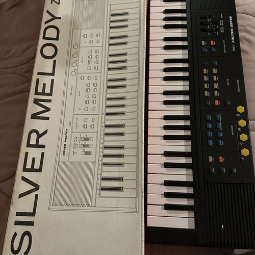 Silver Melody Z4943 collectible harmonium like new with box