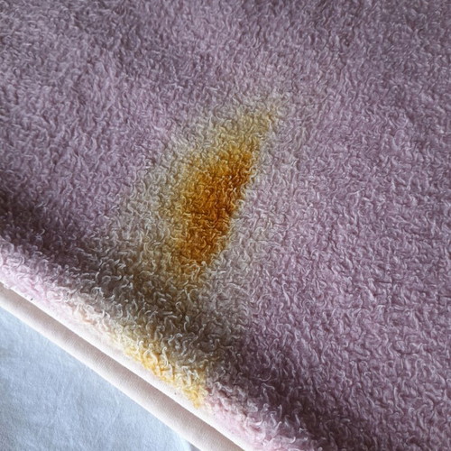 Single blanket used, pink with burn mark