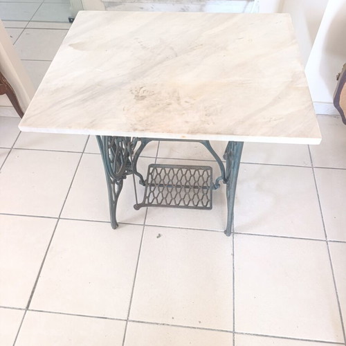 Vintage table console with Singer cast iron base and marble top used