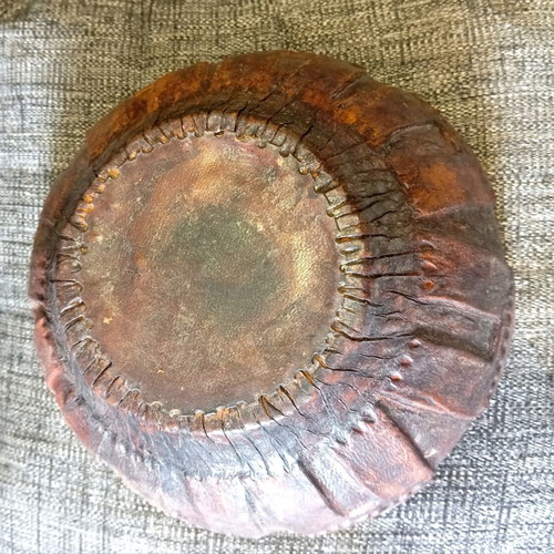 Antique carved wooden bowl with leather lining used