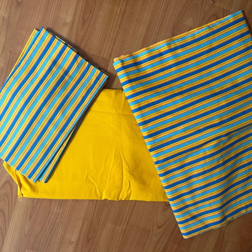 Double bed sheet set with striped top sheet and pillowcases