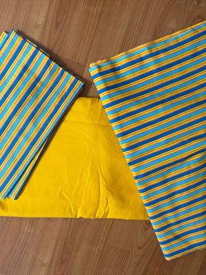 Double bed sheet set with striped top sheet and pillowcases
