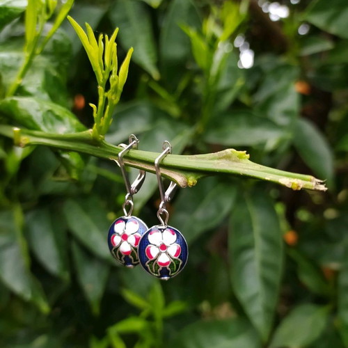 Handmade earrings used with metal elements and enamel