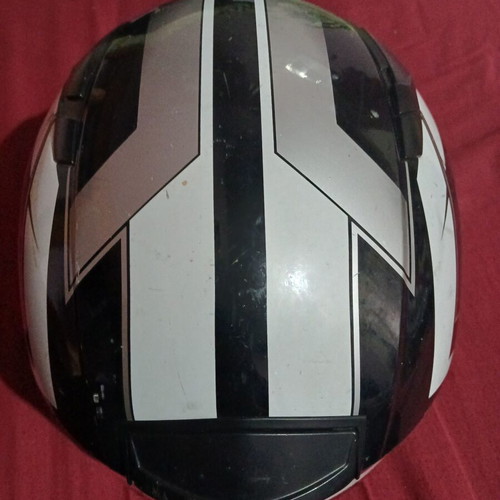 Helmet used, front visor damaged