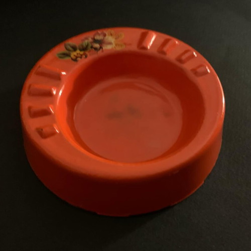 Vintage orange glass ashtray used