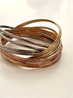 Infinity bracelet like new with mixed gold and silver tones