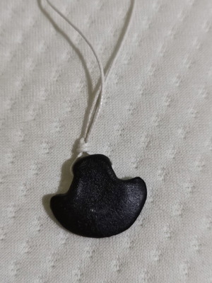 Jewelry pendant with leather cord