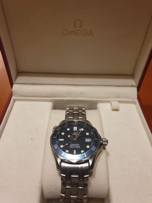 Omega Seamaster watch with papers and box, blue dial
