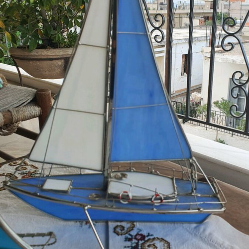 Set of sailboats like new made of steel and glass