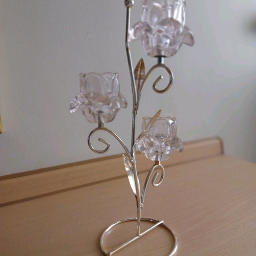 Silver-plated tealight candle holder used with pink flowers