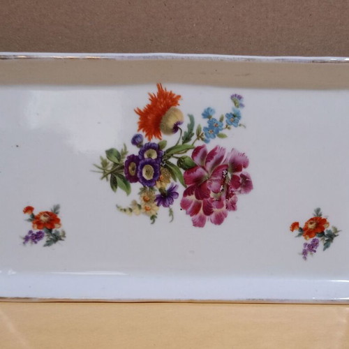 Porcelain tray used with flowers and golden accents