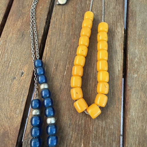 Set of two komboloi like new, one yellow and one blue