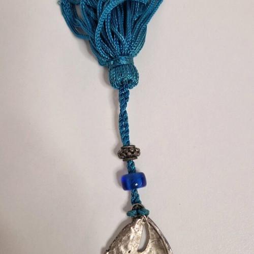 Gouri boat from Mati with blue bead like new
