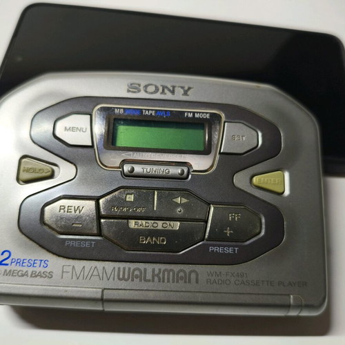 Sony Walkman WM-FX491 cassette player used with original headphones