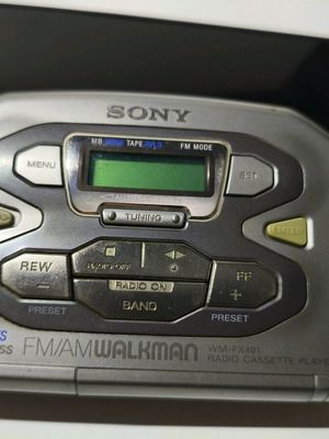 Sony Walkman WM-FX491 cassette player used with original headphones