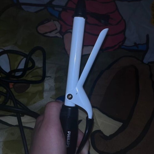 Hair curling iron used with some rust, functional