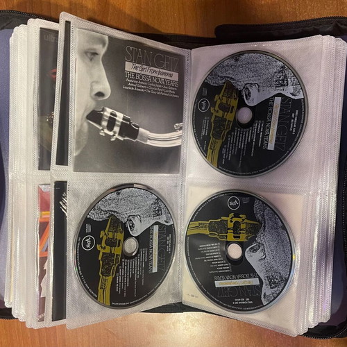 Collection of 64 CDs with carrying case, classical jazz entechno