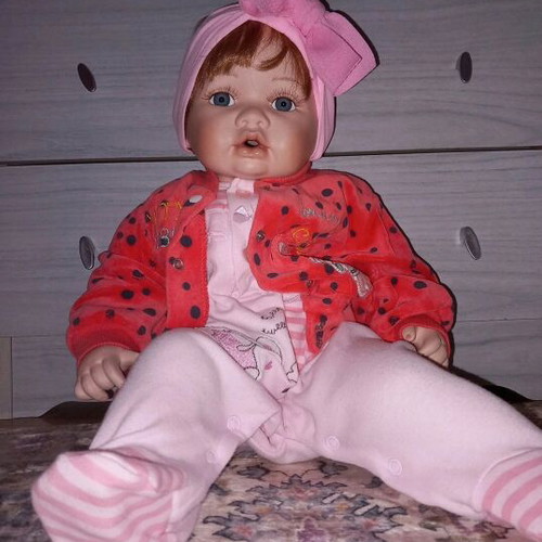 Porcelain doll like new in very good condition