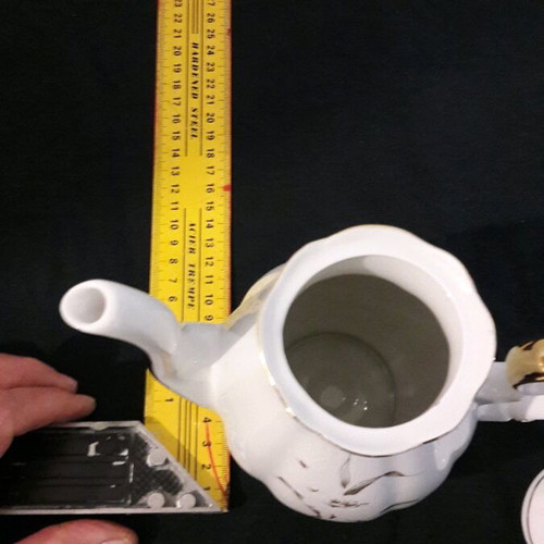 Vintage porcelain teapot and sugar bowl set like new
