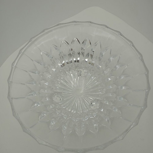 Vintage crystal bowl with intricate cut designs on three elegant legs