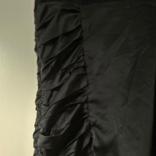 Twentyone L, women's black blouse, made of satin and muslin. The bow at the back.