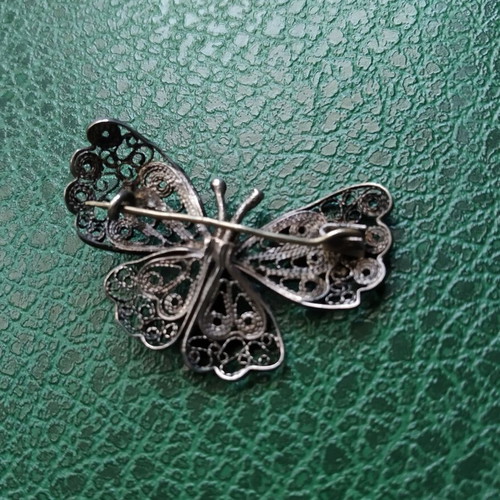 Filigree butterfly brooch used, silver color