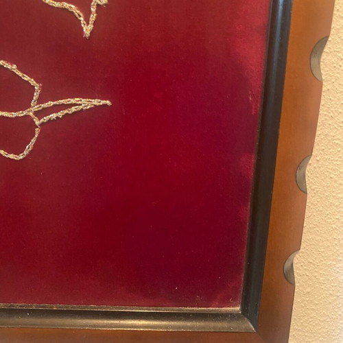 Embroidered painting like new with gold thread on red fabric