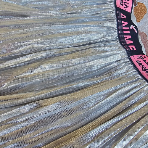 Girls' silver pleated skirt like new, age 10
