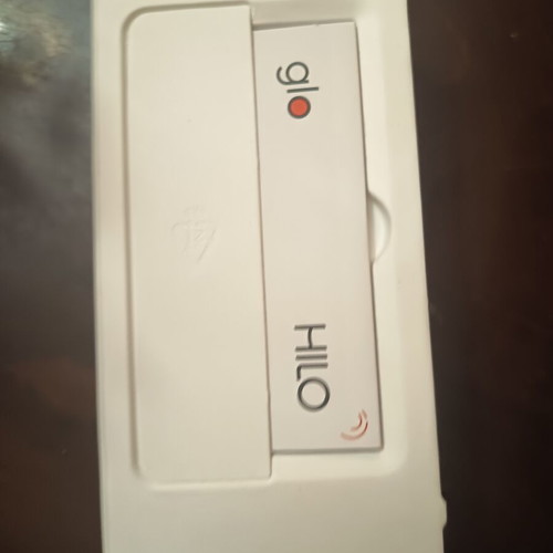 Glo electronic device with charging cable and cleaning brush
