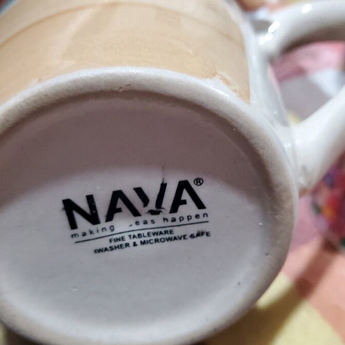 Coffee mugs used, set of 4 with designs and Nava brand