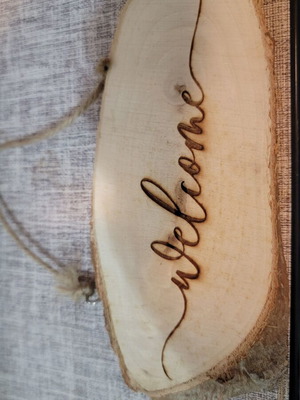 Wooden welcome sign from natural log new