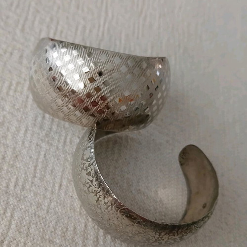 Vintage cuff bracelets like new, embossed geometric and floral design, set of 2