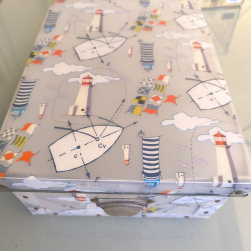Decorative storage box used with nautical theme, lighthouses and flags